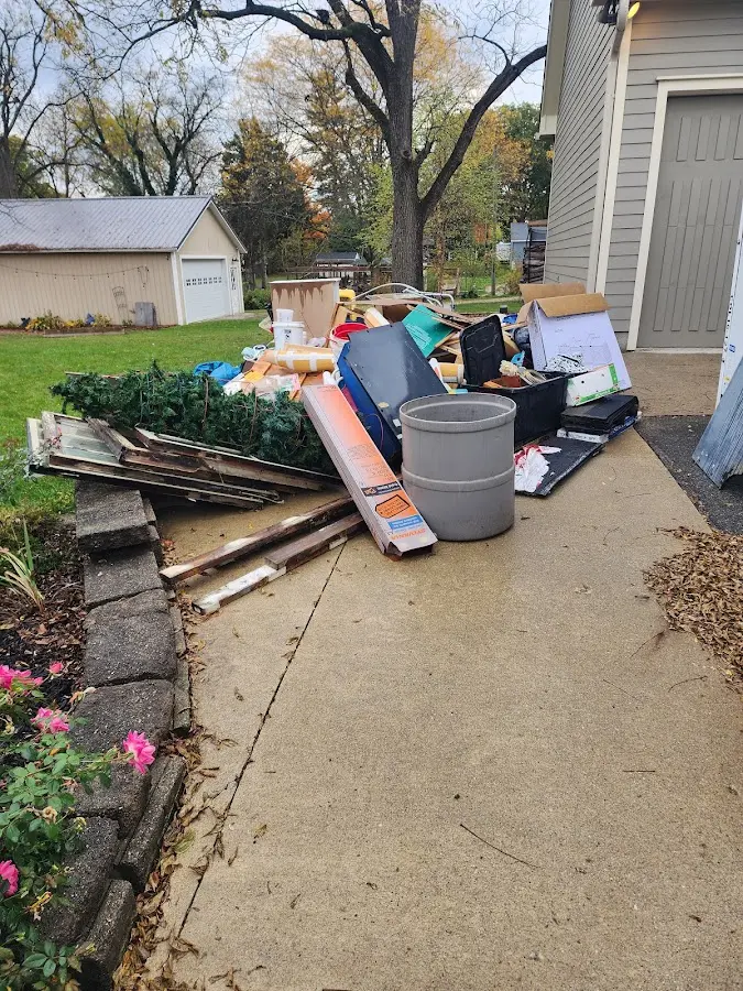 Dumpster being loaded with debris for Roofing Dumpster Rental in Union Springs